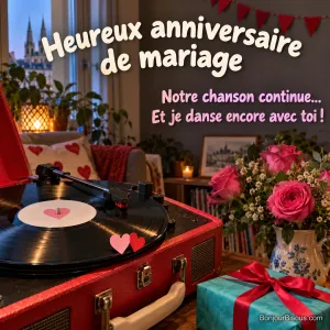 Un disque vinyle tourne sur un électrophone rouge, entouré de cœurs et de décorations d’anniversaire de mariage, avec le texte « Heureux anniversaire de mariage Notre chanson continue… Et je danse encore avec toi ! ».