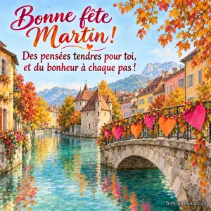 Une guirlande de cœurs en satin colore un pont de pierre au-dessus d’un canal turquoise, avec le message « Bonne fête Martin ! Des pensées tendres pour toi, et du bonheur à chaque pas ! ».